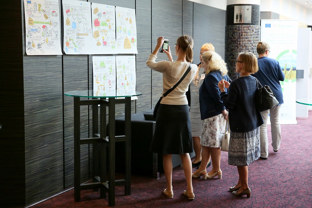 Event participants taking a look at illustrations