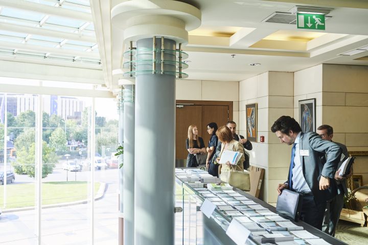 Event participant selecting fi-compass publications